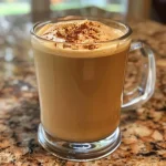 ['Close-up view of a healthy pumpkin spice latte in a clear glass.', 'Side view of a creamy pumpkin spice latte topped with whipped cream and spice.', 'Delicious pumpkin spice latte in a stylish cup with a warm autumn backdrop.', 'Frosty pumpkin spice latte made with almond milk, garnished with cinnamon.']