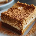['A close-up side view of a moist pumpkin spice protein cake topped with creamy frosting.', 'Display of a pumpkin spice protein cake slice, showcasing its texture and frosting detail.', 'Side view of a delicious protein cake featuring pumpkin spice flavor and frosted topping.', 'Close-up image of a slice of pumpkin spice cake with rich frosting, highlighting its layers.']