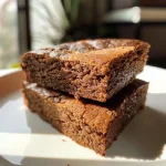 Close-up side view of a moist gingerbread cake without molasses, showcasing its rich texture.